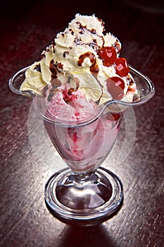 Fruit with ice-cream and chocolate topping.