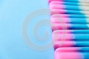 Fruit Ice cream stick , popsicle , ice pop or freezer pop with copyspace on blue pastel background or texture