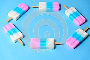 Fruit Ice cream stick , popsicle , ice pop or freezer pop with copyspace on blue pastel background or texture