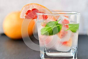 Fruit in ice cubes in water