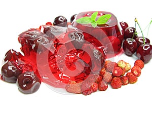 Fruit jelly dessert with wild strawberry and cherry