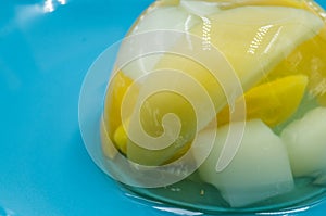 Fruit jelly mix on a blue plate