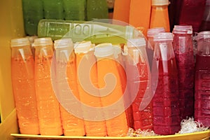 Fruit juice in plastic bottles sell as street food in Thailand