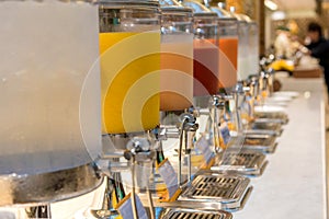 fruit juice in water cooler for breakfast at the hotel