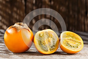 Fruit of lulo or naranjilla on wood