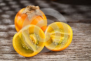 Fruit of lulo or naranjilla on wood