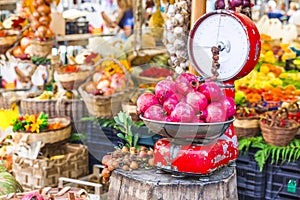 Fruit market with old scales and garnet