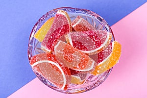 Fruit marmalade on bright colored background