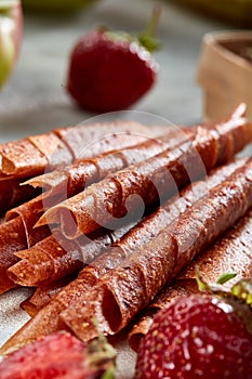 Fruit marshmallow. Berry pastille on light background. Pastille fruit rolls