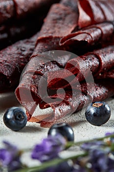 Fruit marshmallow. Berry pastille on light background. Pastille fruit rolls