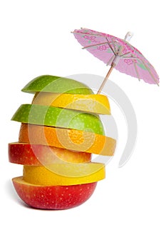 Fruit mix. red apple, green apple, orange, lemon, grapefruit. cocktail umbrella. fruit slicing.