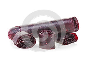 Fruit pastille slices isolated on white background. Fruit roll-ups made from plum and currant