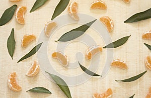 Fruit pattern from Fresh delicious mandarins, tangerine, clementine on a wooden table.