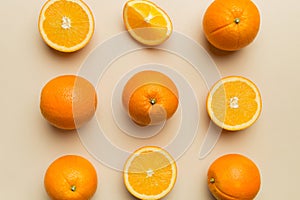 Fruit pattern of fresh orange slices on colored background. Top view. Copy Space. creative summer concept. Half of