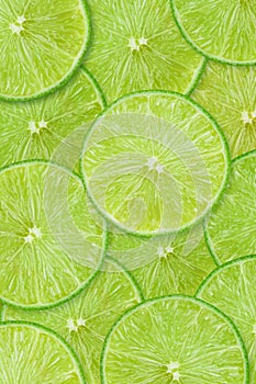 Fruit pattern of lime slices background. Top view