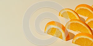 Fruit pattern of orange slices on beige background with copy space. Banner