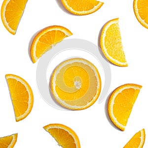 Fruit pattern of orange slices isolated on white background. Top view. Flat lay