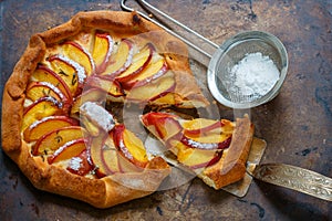 Fruit pie with peaches, nectarines, cinnamon and thyme. Summer dessert for gourmets