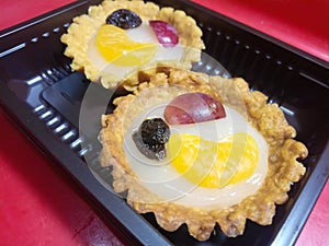 Fruit pie served in a plastic container