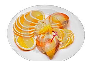 Fruit plate fresh healthy citrus fruits sliced slices of apple, lemon and orange on the white isolated background