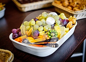 Fruit platter bowl buffet at business or wedding event venue.