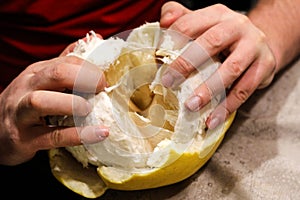 Fruit Pomela in the hands of