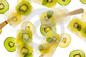Fruit popsicles, homemade fruit ice lolly of various fruits; kiwi fruit and lime with the addition of fresh mint and citrus lemona