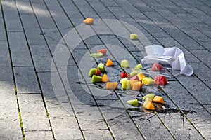Fruit salad accidentally dropped to ground. Misfortune concept photo