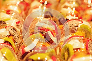 Fruit Salad arranged in plastic cups.