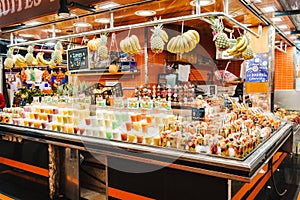 Fruit Salad arranged in plastic cups on a market stall with small fork inside, takeaway snack