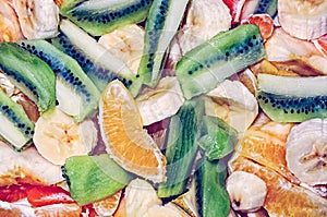 Fruit salad with bananas, oranges and kiwi