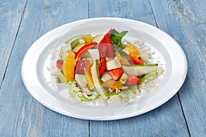 Fruit salad closeup, vegan food at wood