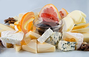 Fruit salad with nuts, raisins and cheese.