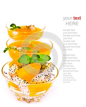 Fruit salad and orange juice on white (with sample text)