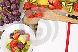 Fruit salad strawberries bowl, cookbook, copy space