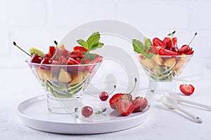 Fruit salad of strawberries, kiwis and apricots. Fresh and tasty