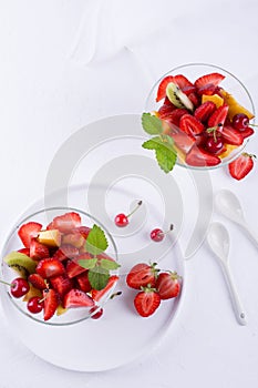 Fruit salad of strawberries, kiwis and apricots. Fresh and tasty snack .