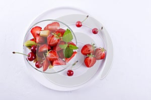 Fruit salad of strawberries, kiwis and apricots. Fresh and tasty snack