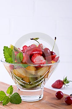 Fruit salad of strawberries, kiwis and apricots. Fresh and tasty snack, dessert