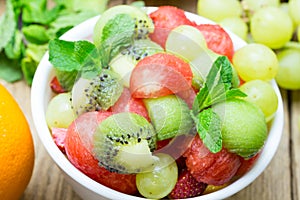 Fruit salad with strawberries, oranges, kiwi, grape and watermel