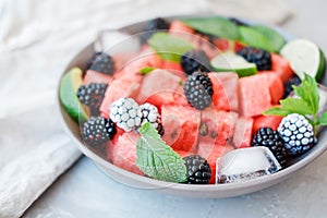 Fruit salad from Watermelon slices, frozen blackberry and lime o