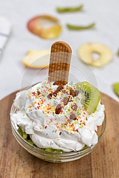 Fruit salad whipped cream flat lay white marble table