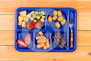 Fruit sampler in lunch tray with fork