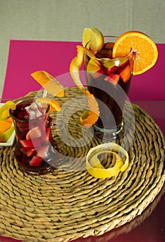 fruit sangria on the glass table with different fruits