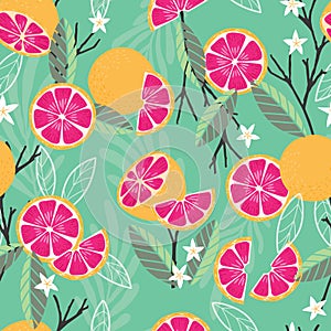 Fruit seamless pattern, grapefruit with branches, leaves and flowers on green background. Summer vibrant design. Exotic tropical