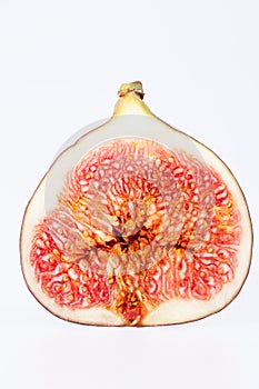 Fruit of sectioned fresh fig isolated on white background