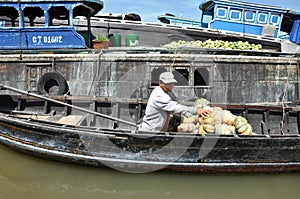 Fruit seller in the Cai Rang Floating market, Mekong delta, Vietnam