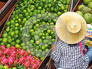 Fruit seller at Floating Bazaar in Thailand