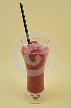 Fruit Shake in a Glass with a Straw. photo