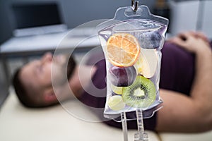 Fruit Slices Inside Saline Bag Hanging In Hospital